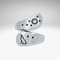 Howl Adjustable Ring featuring engraved wolf, moon, and stars in a matte silver finish.