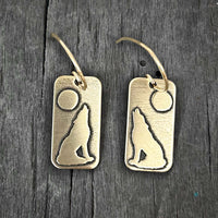 Howl Earrings featuring a howling wolf and full moon design, crafted in raw brass with earwire.