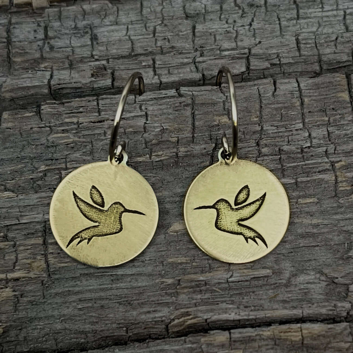Hummingbird Earrings with engraved design on circle discs, showcasing delicate hummingbirds.