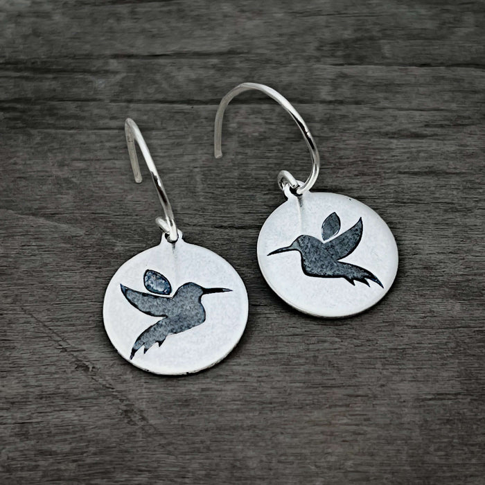 Hummingbird Earrings featuring sterling silver design with engraved hummingbirds on circle discs.
