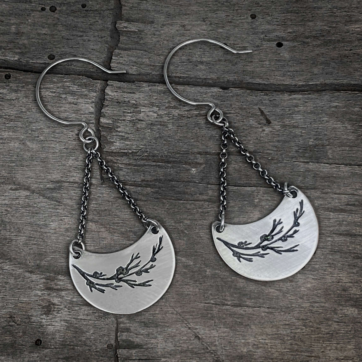 Juniper Earrings -Flowery Branch Nature dangle earrings showcasing etched juniper sprigs on raw brass.