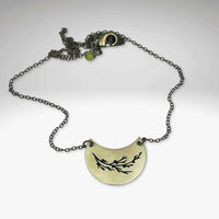 Juniper Necklace featuring a sprig pendant with leaves and berries on a rolo chain.
