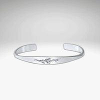 Juniper Signet Cuff Bracelet in matte silver finish with etched juniper twig design.