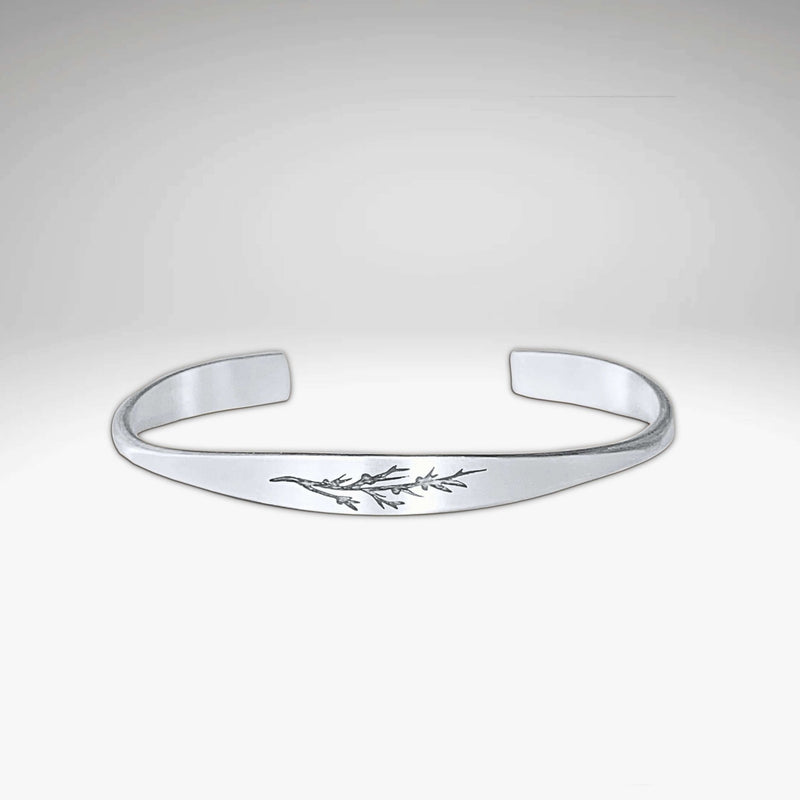 Juniper Signet Cuff Bracelet in matte silver finish with etched juniper twig design.