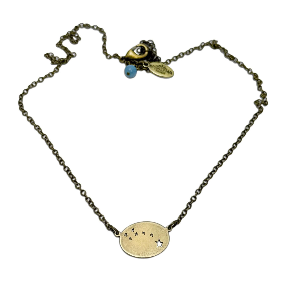 Little Dipper Necklace featuring seven stars of Ursa Minor constellation in antique brass finish.