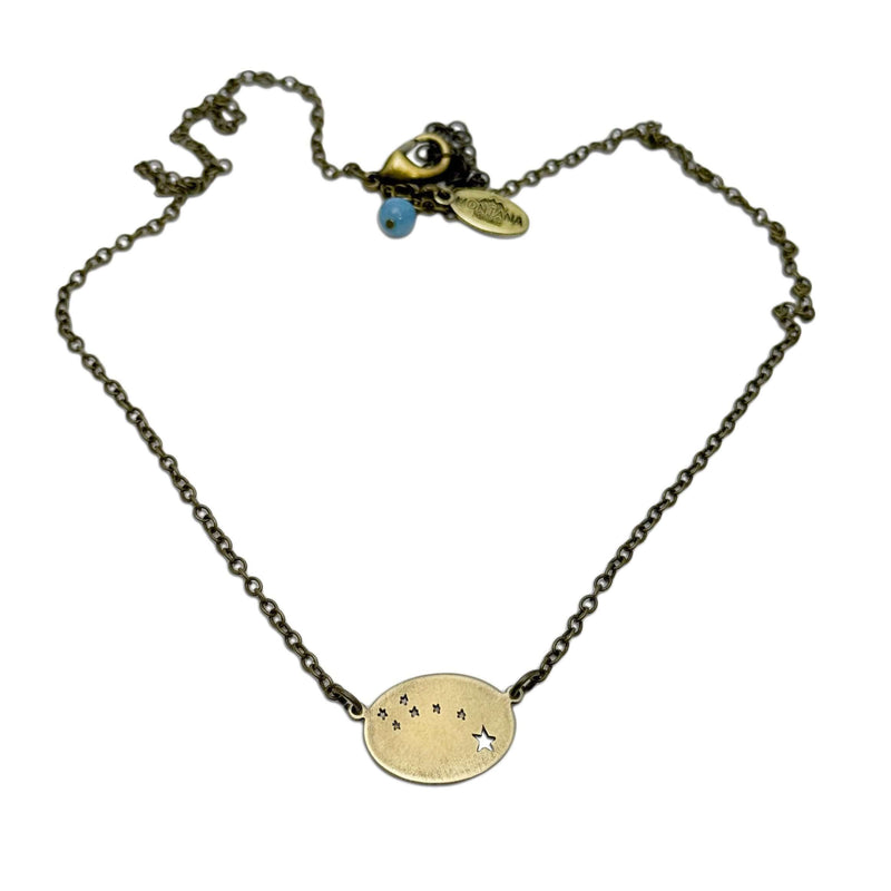 Little Dipper Necklace featuring seven stars of Ursa Minor constellation in antique brass finish.