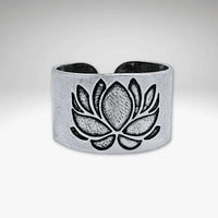 Lotus Adjustable Ring showcasing a beautifully etched lotus design in matte silver finish.