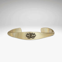 Lotus Signet Cuff Bracelet showcasing a lotus motif, symbolizing resilience and personal growth.