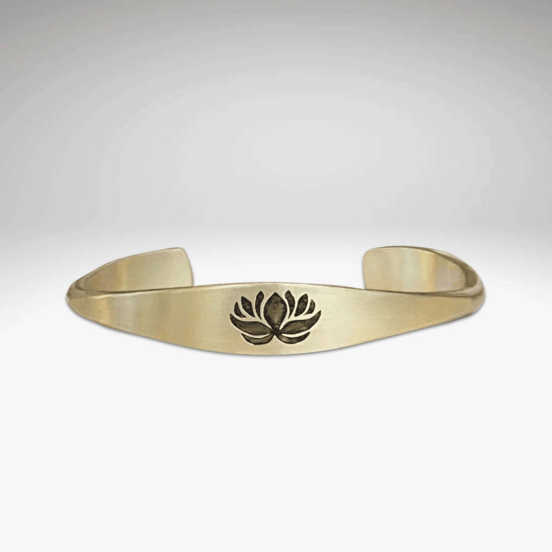 Lotus Signet Cuff Bracelet showcasing a lotus motif, symbolizing resilience and personal growth.