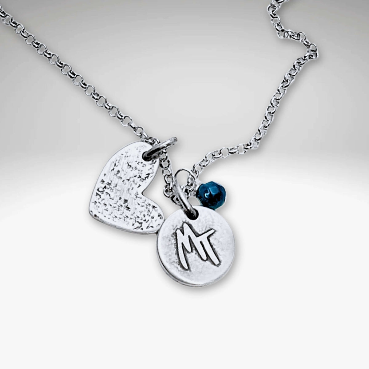 Love Montana Necklace featuring a light hammer finish, MT engraving, and heart charm in Matte Silver.