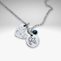 Love Montana Necklace featuring a light hammer finish, MT engraving, and heart charm in Matte Silver.