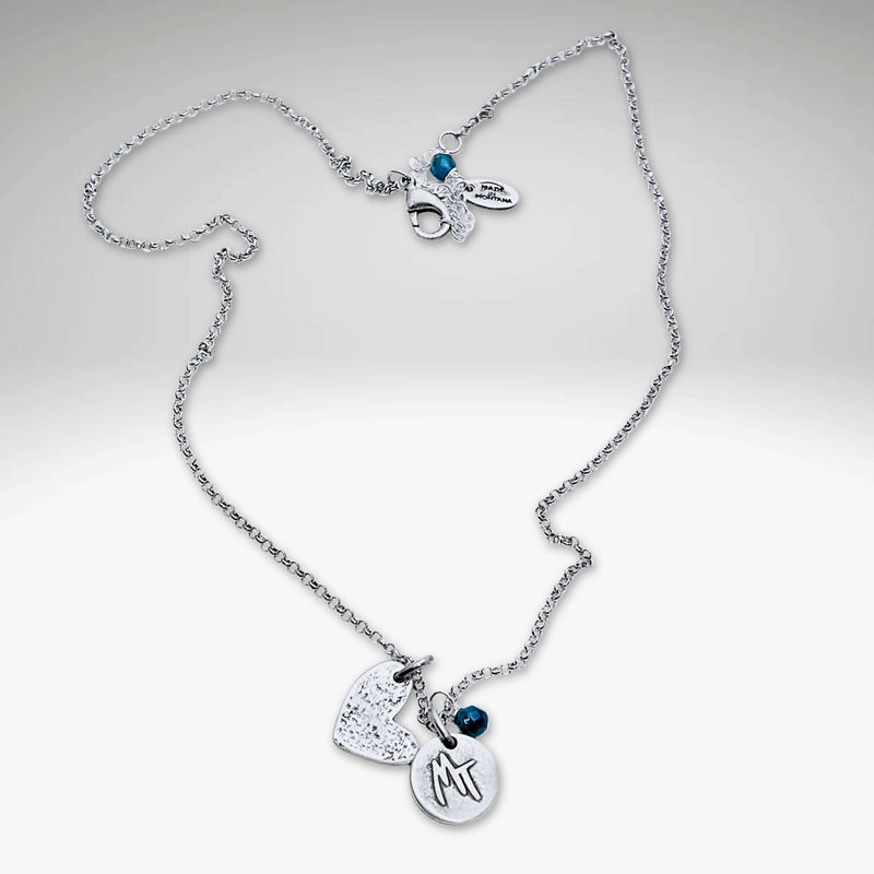 Love Montana Necklace featuring a light hammer finish with delicate MT engraving and blue accents, available in Matte Silver.