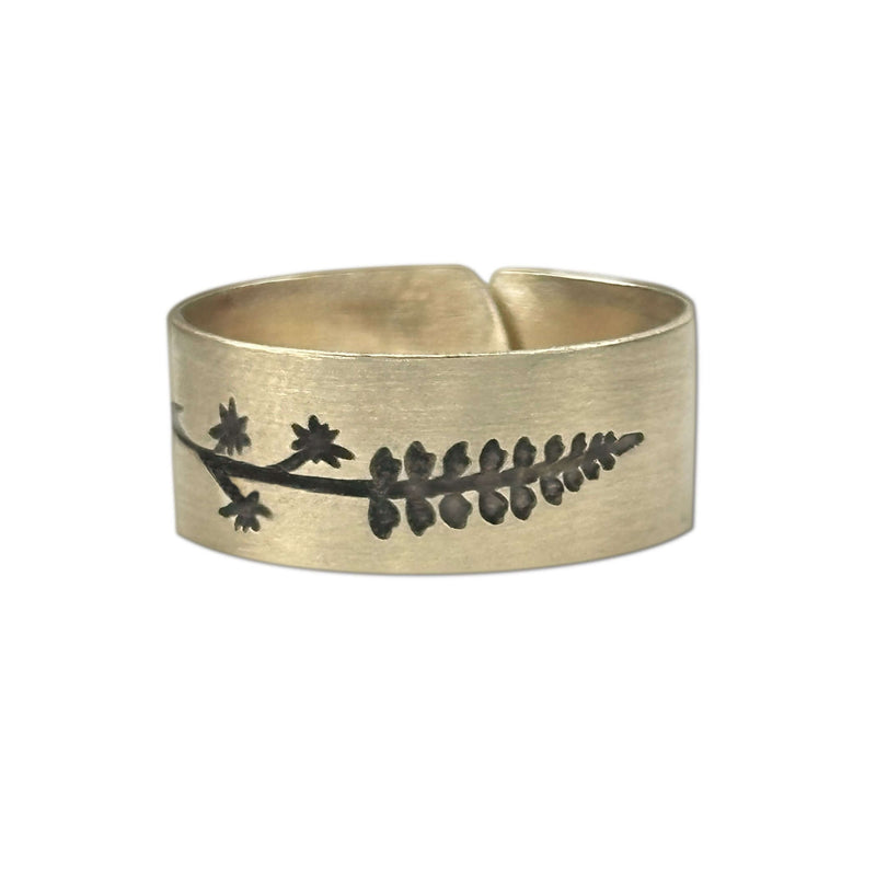 Lupine Adjustable Ring in Antique Brass featuring a detailed wildflower design, adjustable for sizes 7 to 11.