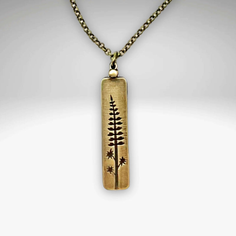 Lupine Necklace with an artwork pendant depicting wildflowers, perfect for adding summertime beauty to any outfit.