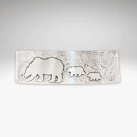 Mama and Cubs Cuff Bracelet featuring etched bear and cub designs on a textured brass surface.