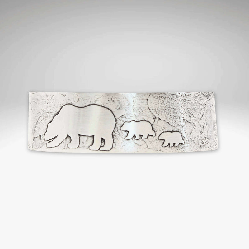 Mama and Cubs Cuff Bracelet featuring etched bear and cub designs on a textured brass surface.
