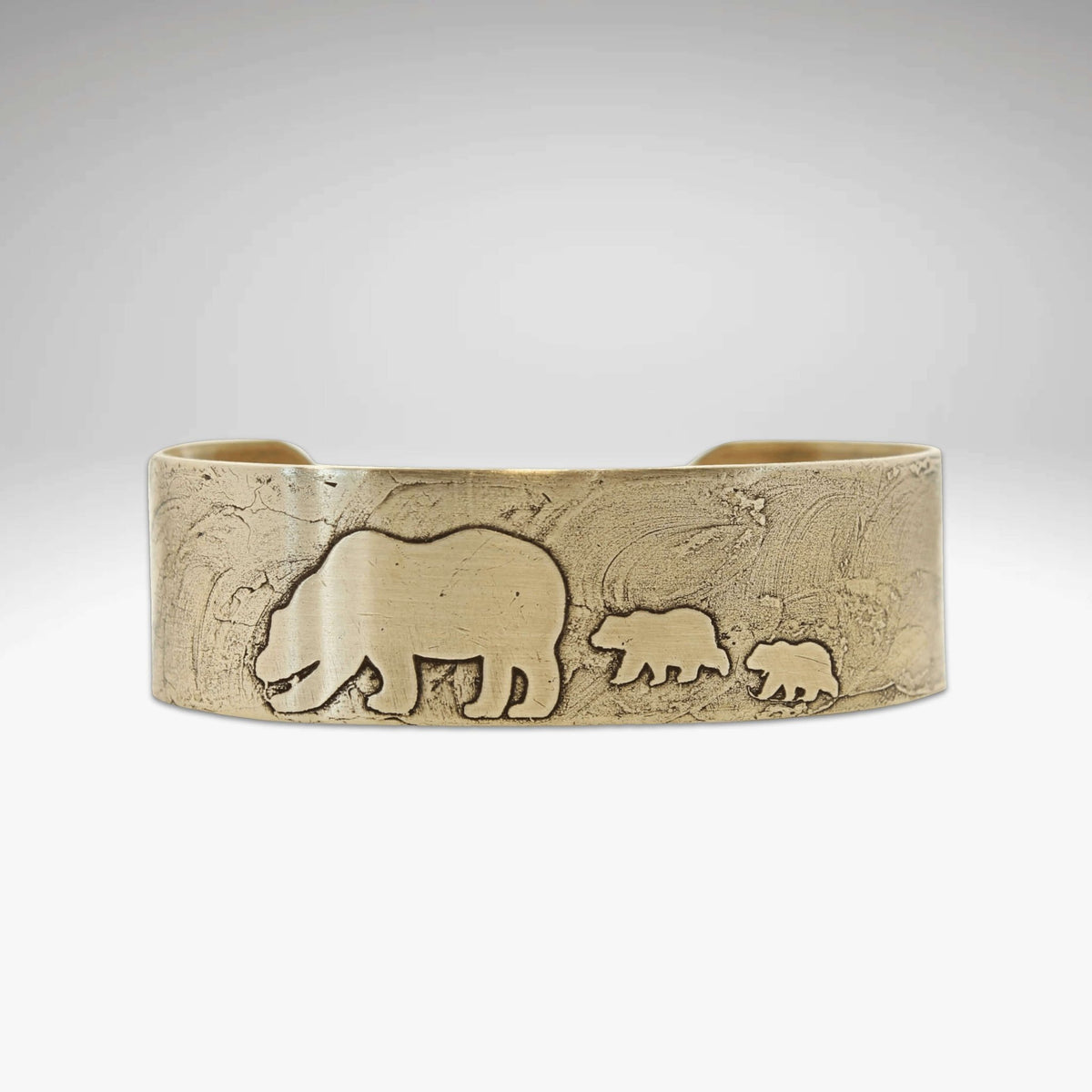 Mama and Cubs Cuff Bracelet featuring a brass cuff with bear and cub designs, showcasing unique acid-free etching.