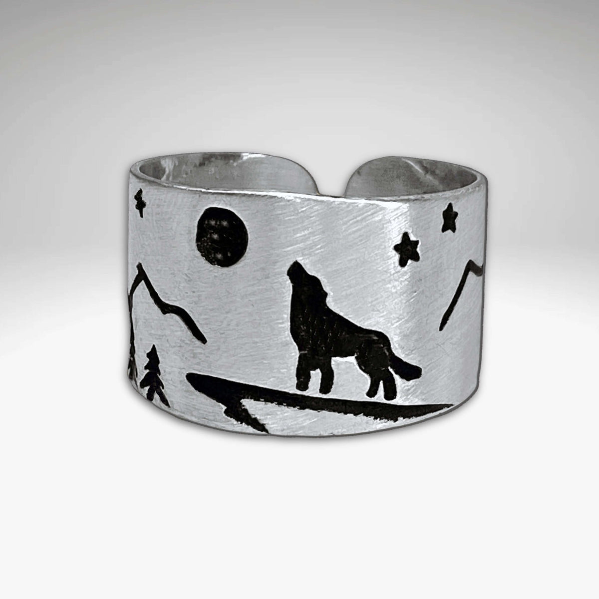 Midnight Wolf Adjustable Ring featuring a wolf howling at the moon with stars and mountains in Matte Silver finish.