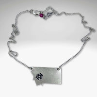 Montana Bitterroot Necklace shown in matte silver finish with state outline and sun design.