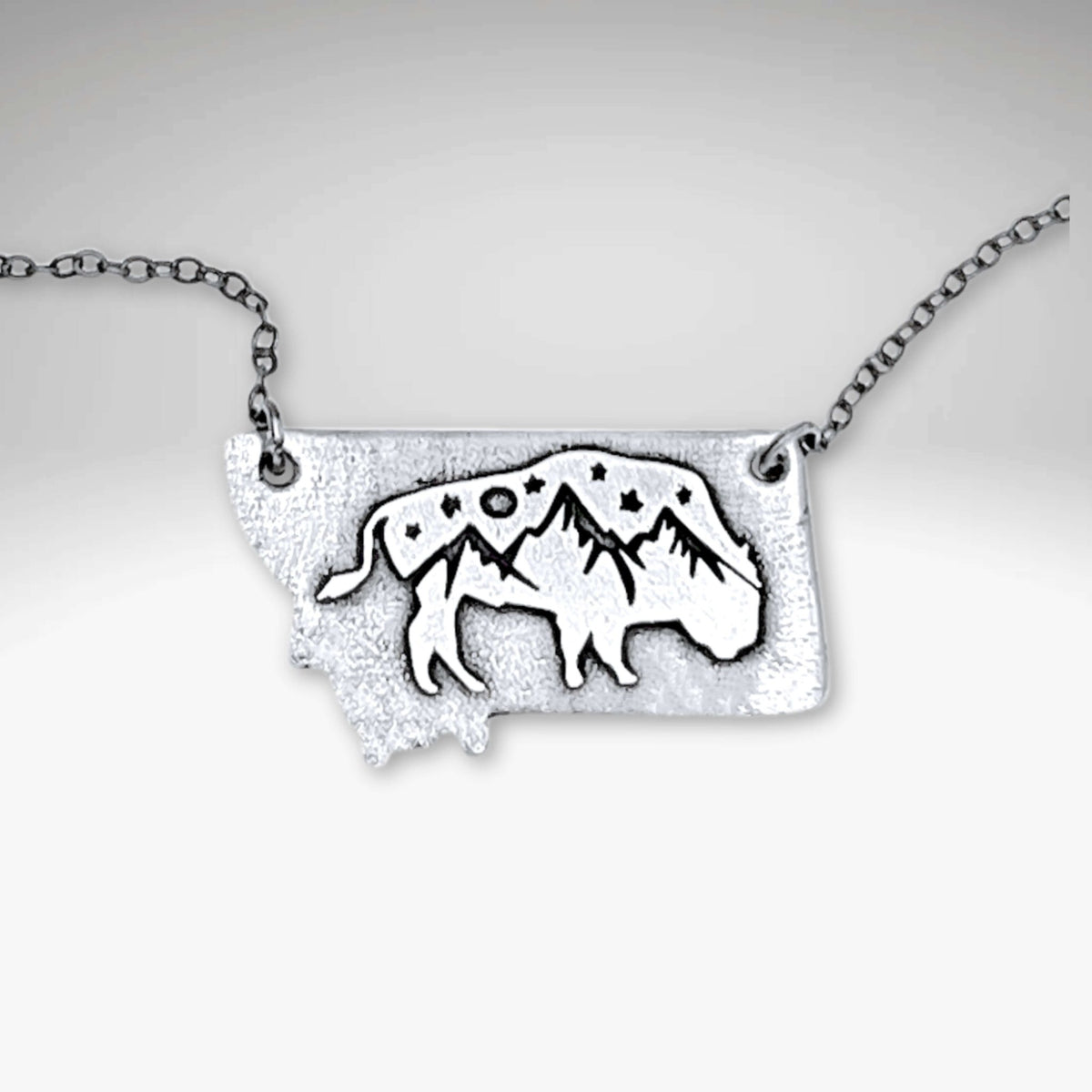 Montana High Alpine View necklace featuring bison and mountain peaks in a Montana silhouette.