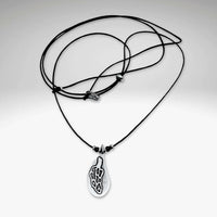 Morel Mushroom Necklace showcasing an intricately etched morel pendant on a stylish cord.