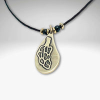 Morel Mushroom Necklace featuring a solid brass pendant on a leather cord with decorative beads.