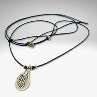 Morel Mushroom Necklace featuring a solid brass pendant on a leather cord with decorative beads.