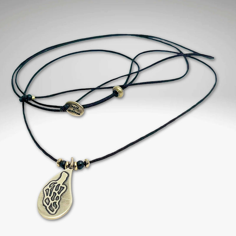 Morel Mushroom Necklace featuring a solid brass pendant on a leather cord with decorative beads.