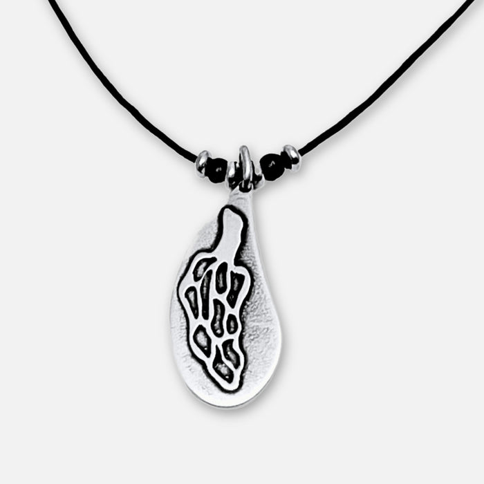 Morel Mushroom Necklace with etched solid brass pendant on a black cord, showcasing nature's beauty.