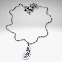 Morel Mushroom Necklace featuring an intricately etched morel pendant on a delicate chain.