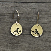 Mountain Bluebird Earrings featuring etched bluebirds on a teardrop shape in antique brass finish.