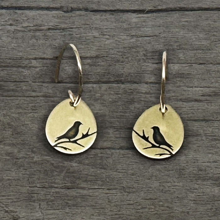 Mountain Bluebird Earrings featuring etched bluebirds on a teardrop shape in antique brass finish.