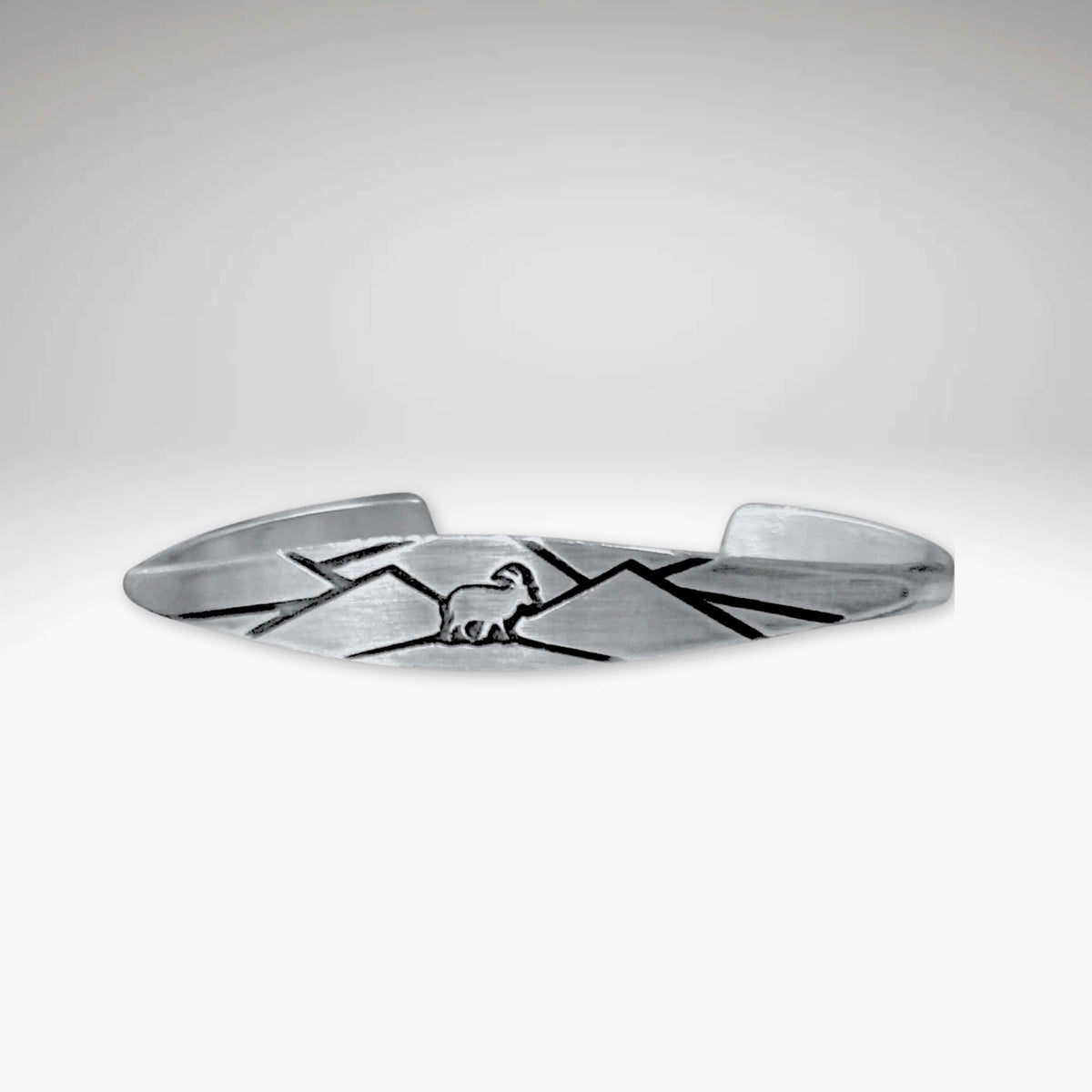 Mountain Goat Cuff Bracelet in matte silver finish with mountain design showcasing the majestic mountain goat.