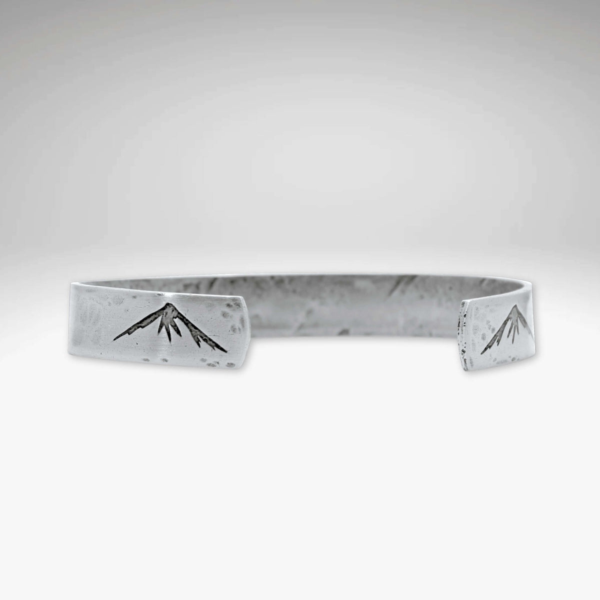 Mountain Peaks Cuff Bracelet showcasing mountain peaks design, handmade cuff perfect for outdoor enthusiasts.