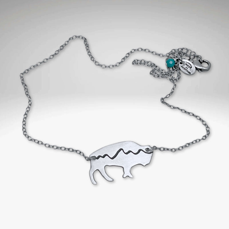Mountains on Buffalo Necklace featuring a bison design on a silver chain.
