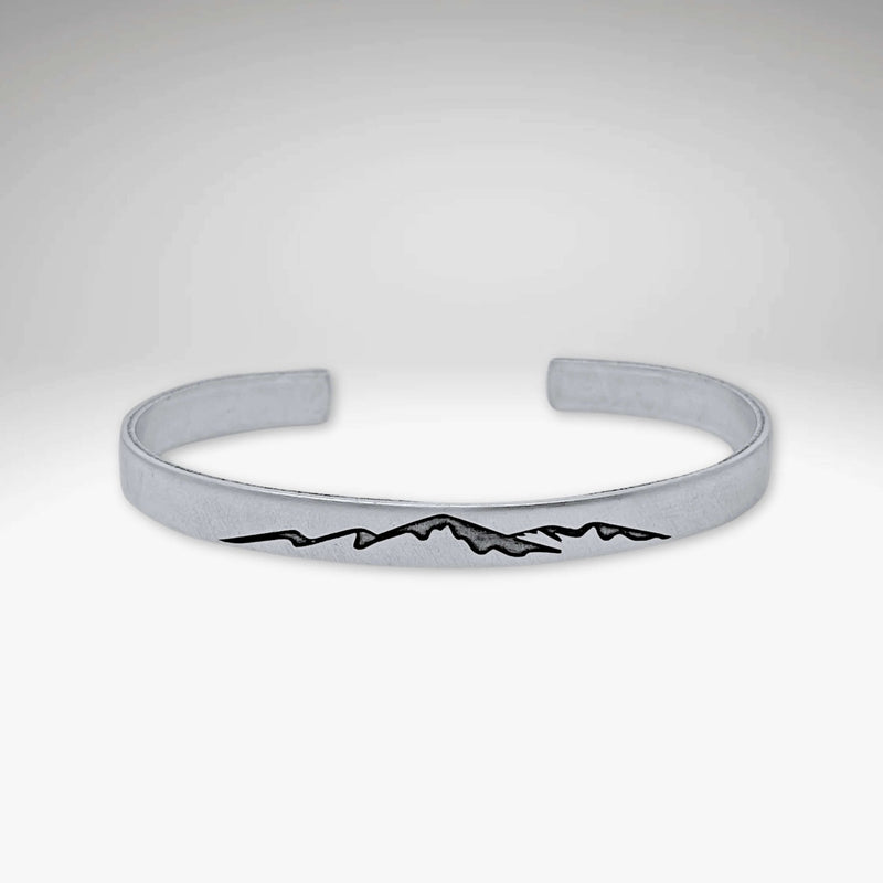 Mountainscape Mountain Cuff Bracelet in matte silver with mountain design etched on surface.