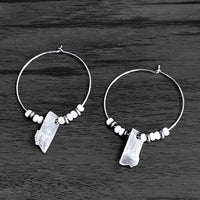 MT Beaded Hoop Earrings with white seed beads and matte silver Montana cutouts.