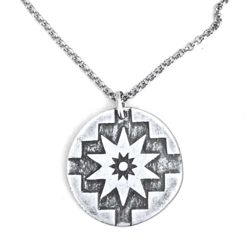 Northstar Necklace featuring a silver pendant with star design on an adjustable chain.