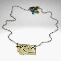 On the Front in Montana Necklace featuring a brass grain elevator and mountains on an adjustable chain.