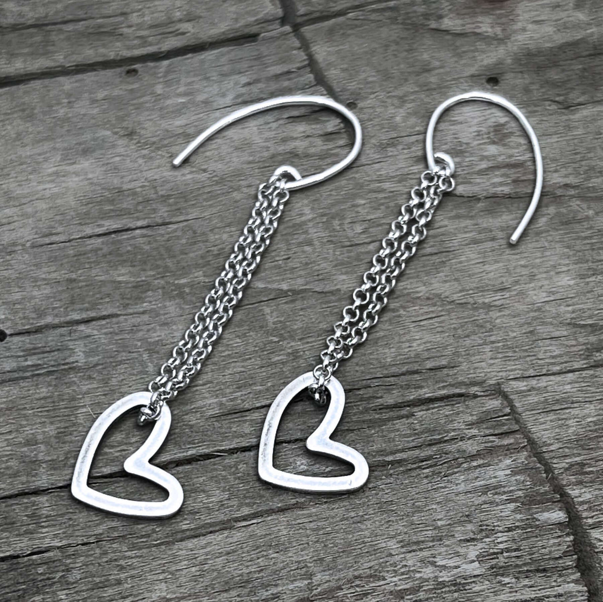 Open Heart Earrings on a rolo chain with sterling silver earwires, featuring delicate heart dangles.