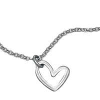 Open Heart Necklace showcasing a handmade silver heart pendant on a delicate chain.