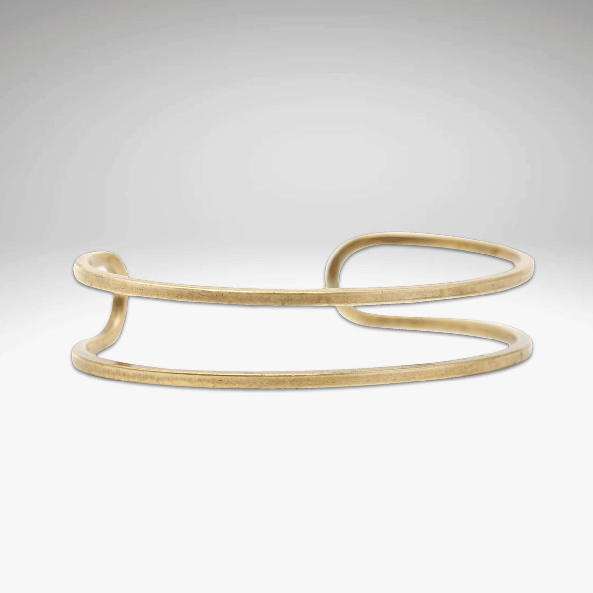 Open Space Cuff Bracelet in Antique Brass finish, showcasing elegant and sophisticated design.