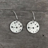 Orion's Belt Earrings featuring minimalist disk accents with star motifs, perfect for everyday wear.