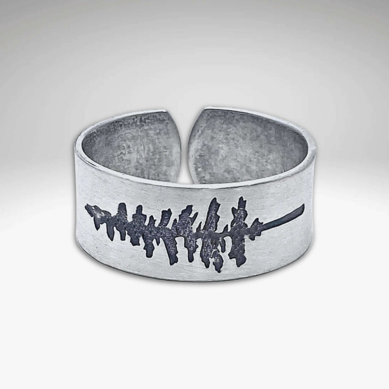 P Pine Adjustable Ring in matte silver showcasing a design inspired by pine trees, symbolizing wisdom and endurance.