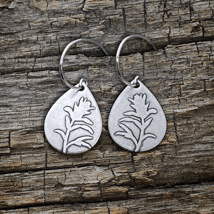 Paintbrush Flower Earrings in matte silver, featuring a beautifully etched wildflower design on teardrop plates.