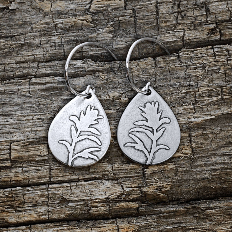 Paintbrush Flower Earrings in matte silver, featuring a beautifully etched wildflower design on teardrop plates.