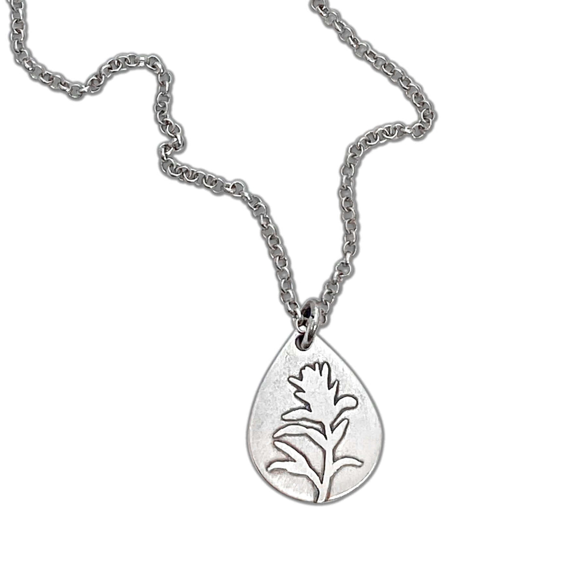 Paintbrush Necklace featuring a silver teardrop pendant with an Indian Paintbrush flower design.