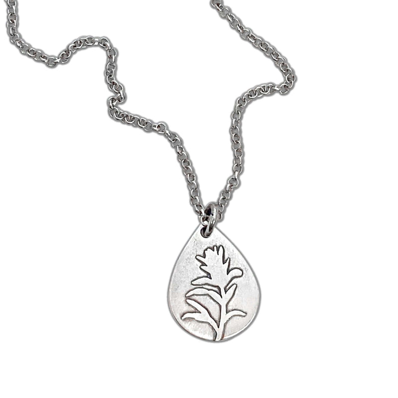 Paintbrush Necklace featuring a silver teardrop pendant with an Indian Paintbrush flower design.