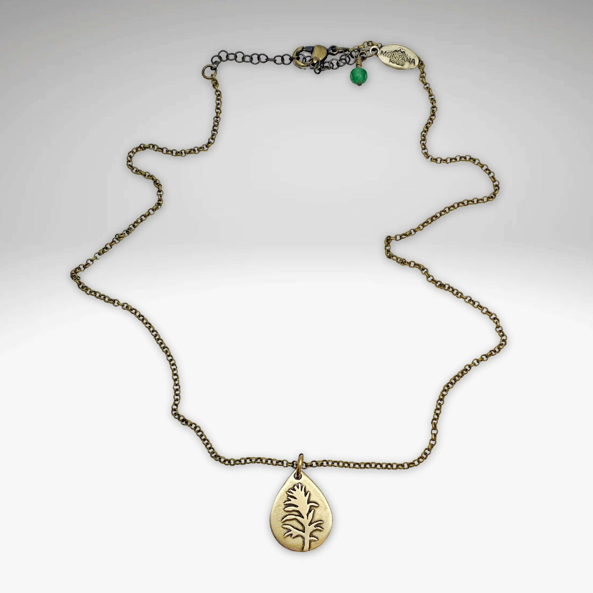 Paintbrush Necklace featuring a teardrop-shaped pendant depicting the Indian Paintbrush flower.