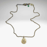 Paintbrush Necklace featuring a teardrop-shaped pendant depicting the Indian Paintbrush flower.